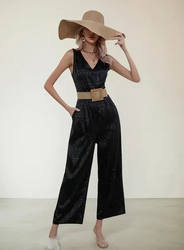 Mono negro con cinturón sin mangas de fiesta