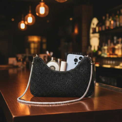 Cartera clutch dorado, negro y plateado con brillos, de mano