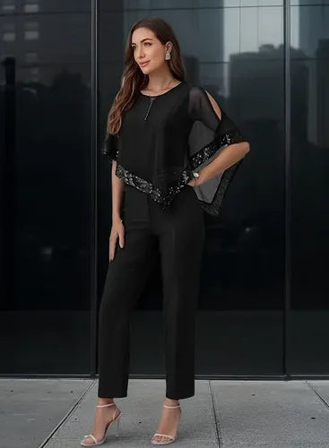 Mono negro de lentejuelas con manga corta para fiesta y gala