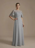 Vestido largo gris con capa corta cuello redondo