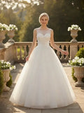 Vestido de novia corte princesa de tul cuello cubierto